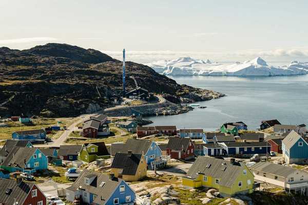 Ilulissat, Greenland - coastal village with icebergs floating in bay