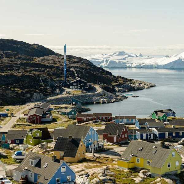 Ilulissat, Greenland - coastal village with icebergs floating in bay