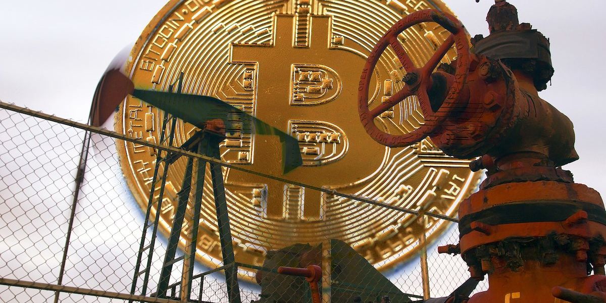 Image of an oil pump jack and fence is superimposed in front of a giant crypto coin.