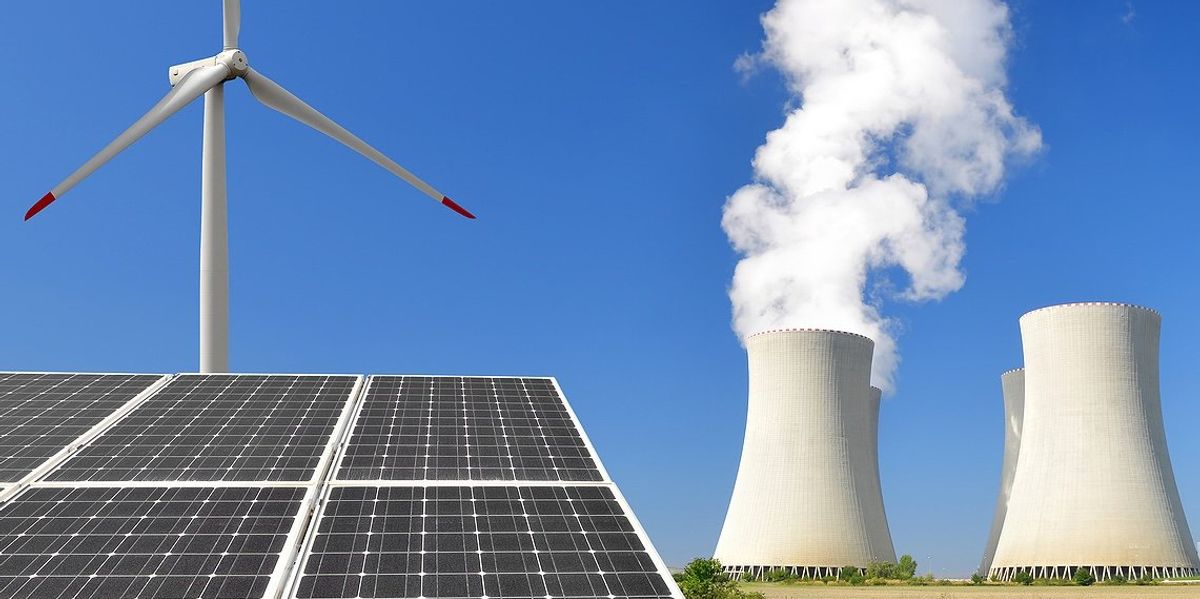 Image of Wind turbines, solar panels, and power plant towers.