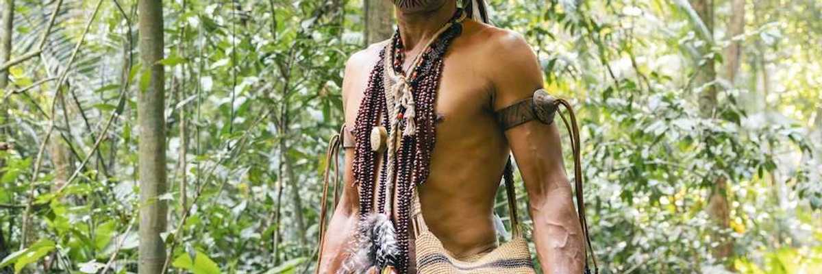 Indigenous Amazonian male in traditional garb