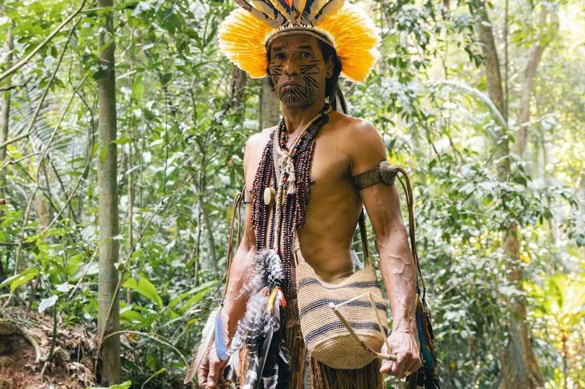 Indigenous Amazonian male in traditional garb