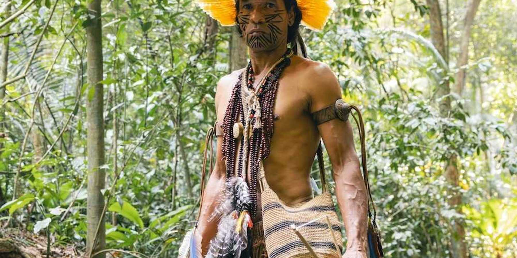 Indigenous Amazonian male in traditional garb
