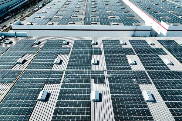 Industrial warehouse covered with solar panels