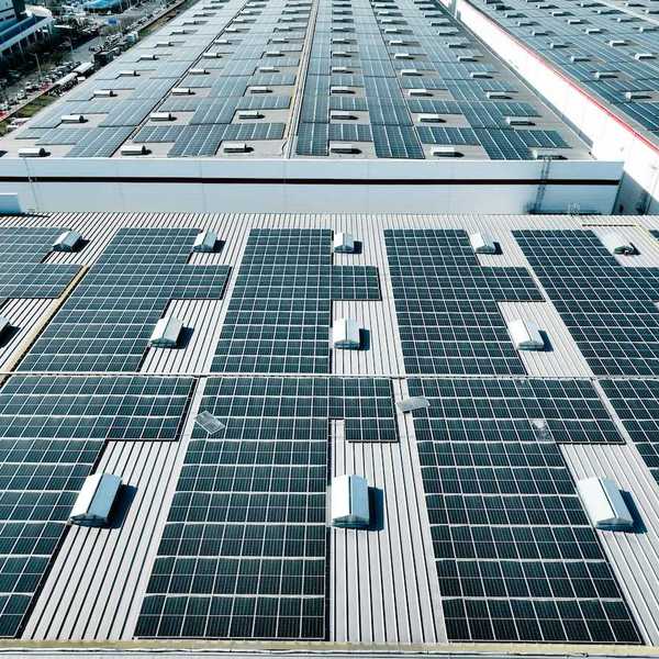 Industrial warehouse covered with solar panels