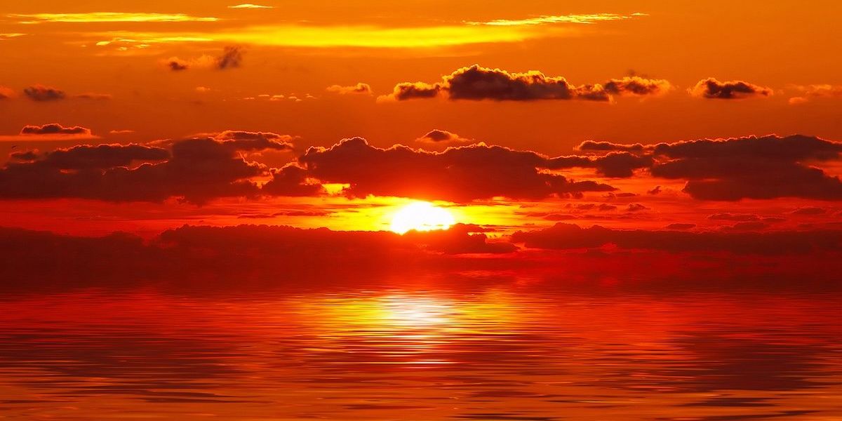 Intensely red sunset over ocean