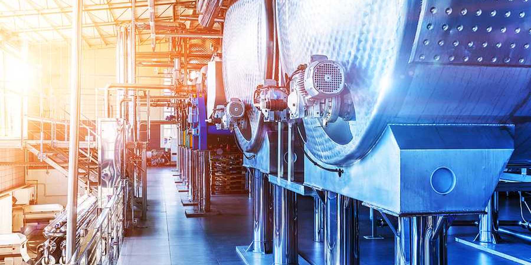 Interior of chemical factory or plant workshop with metal industrial manufacturing production equipment