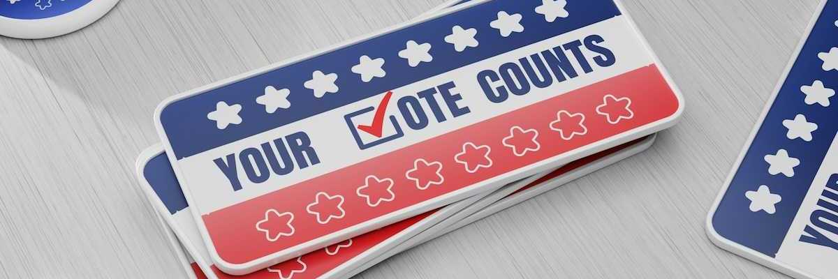 Items meant to encourage people to vote "YOUR √OTE COUNTS"