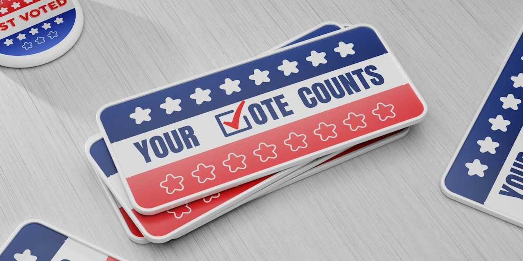 Items meant to encourage people to vote "YOUR √OTE COUNTS"