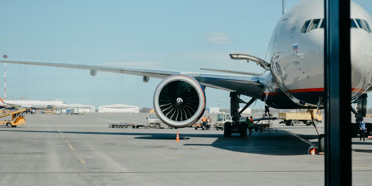 Jetliner parked on an airport tarmac.