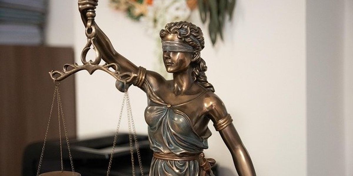 Lady justice statue holding scales.