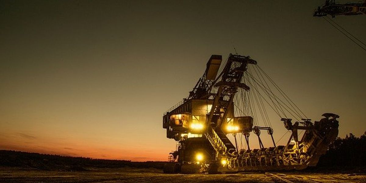 large mining equipment lit up at night