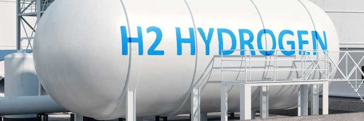 Large white storage tank with blue letters reading, "H2 HYDROGEN"