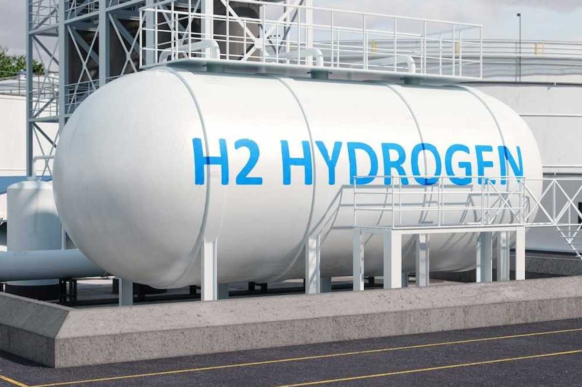 Large white storage tank with blue letters reading, "H2 HYDROGEN"