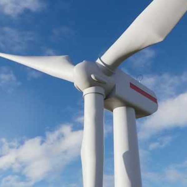 Large white wind turbine on a sunny day