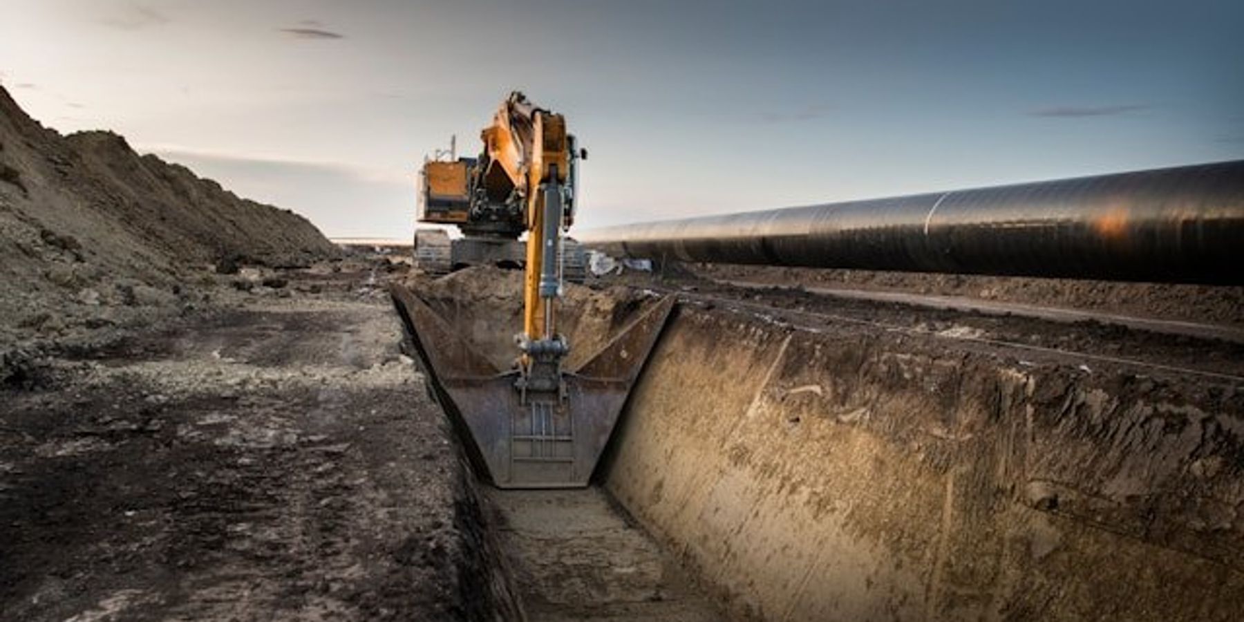 Machinery digging a trench for a pipeline.