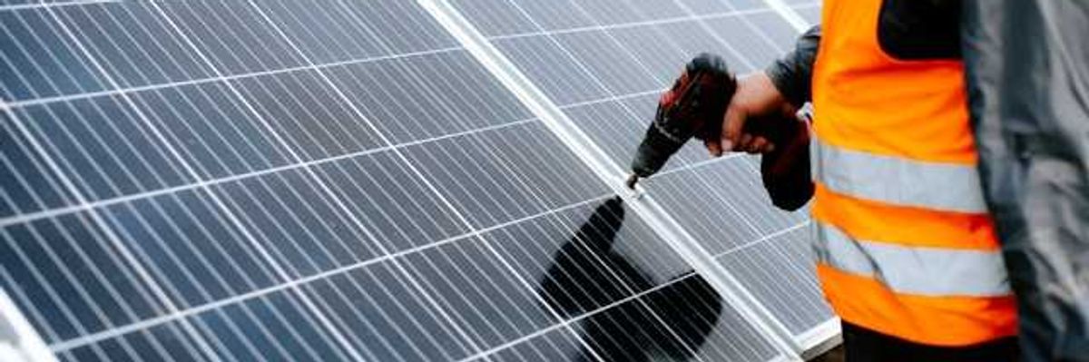Man installing a solar panel