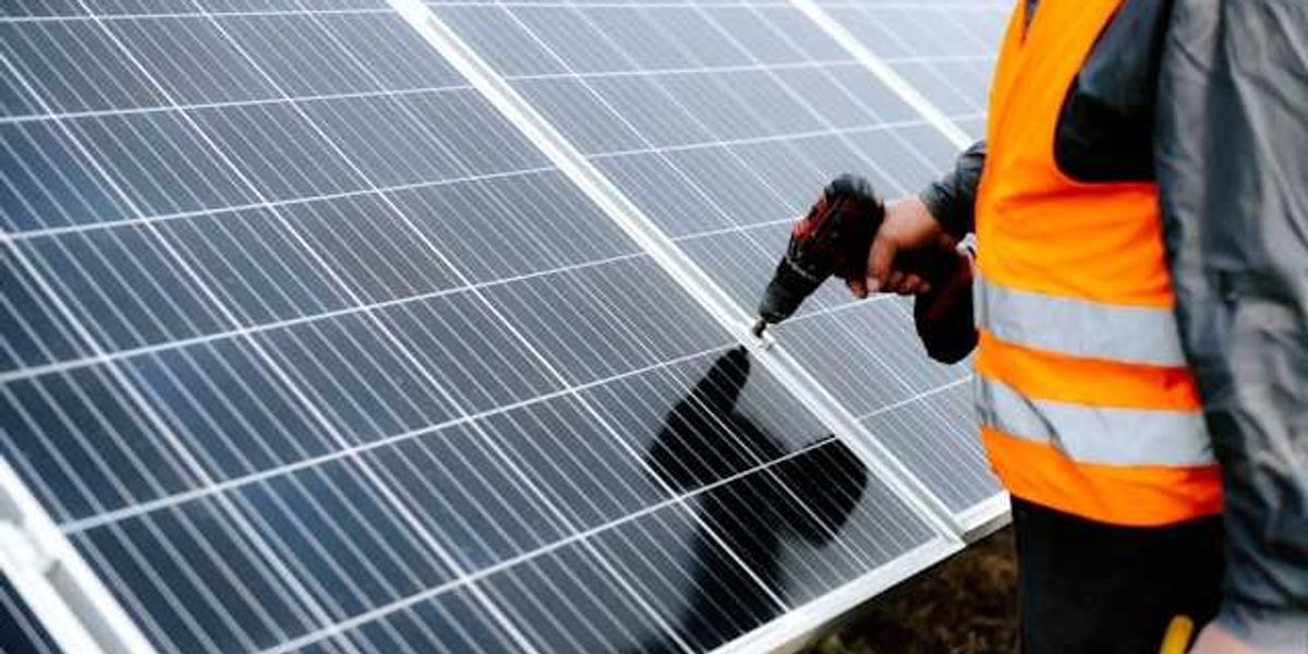 Man installing a solar panel