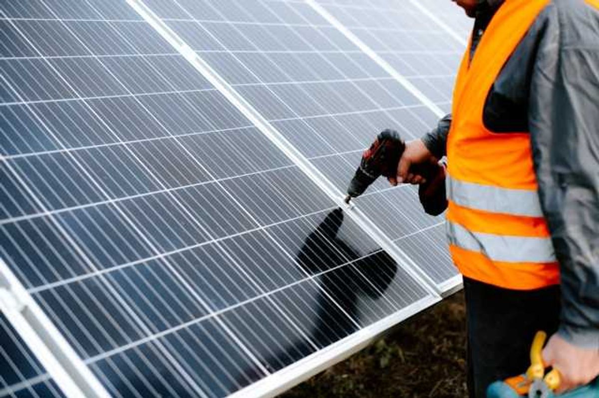 Man installing a solar panel