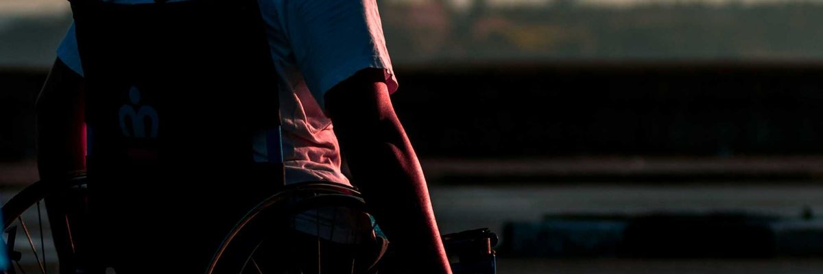 man sitting in wheelchair during daytime.