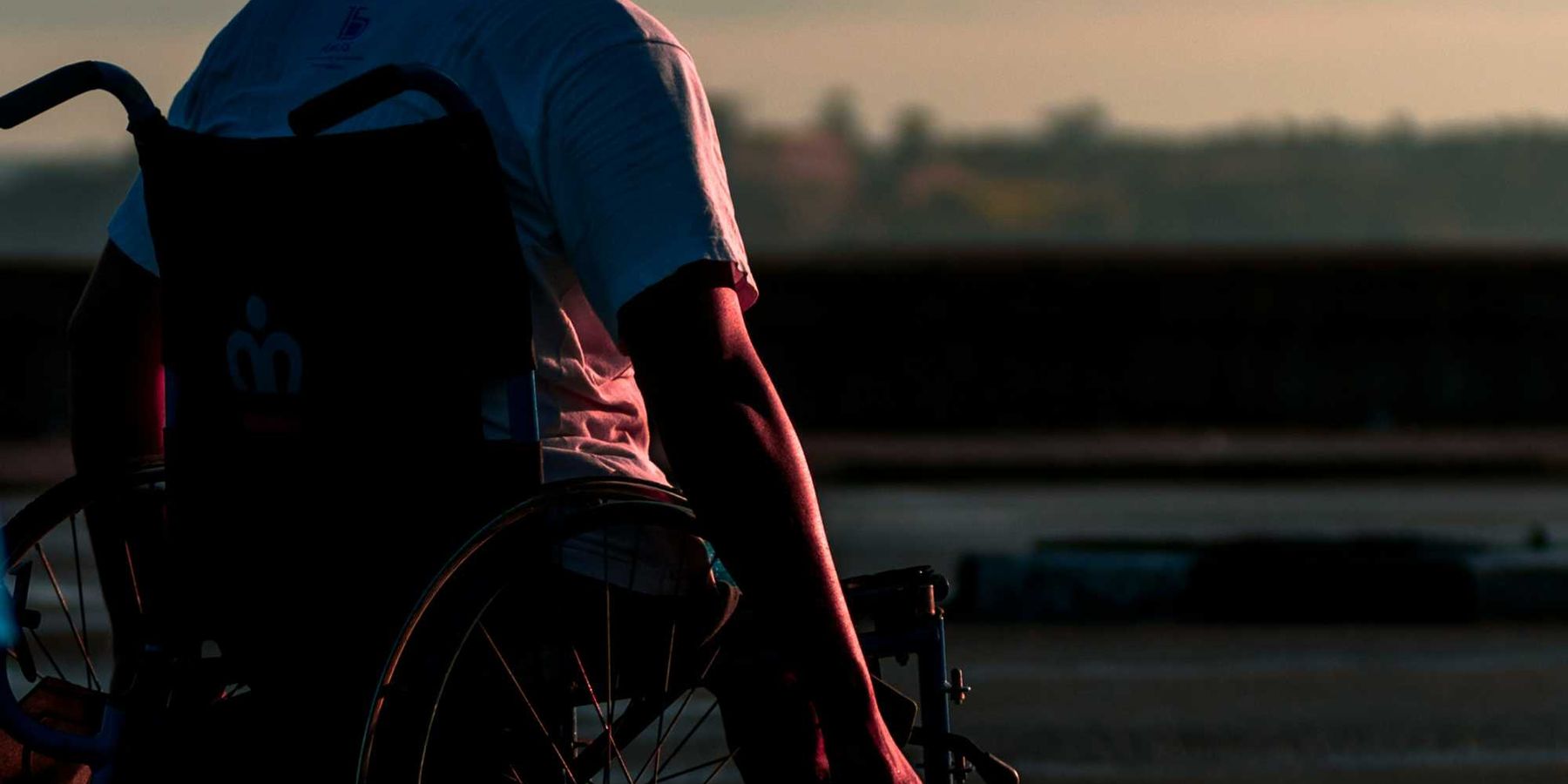 man sitting in wheelchair during daytime.