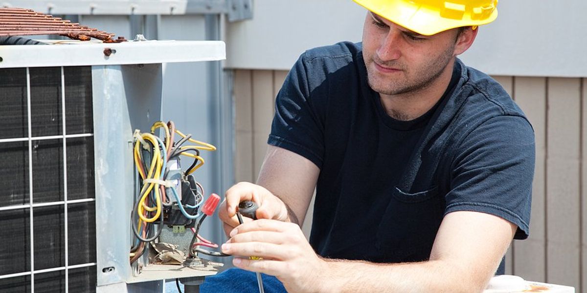 man working on electrical wiring