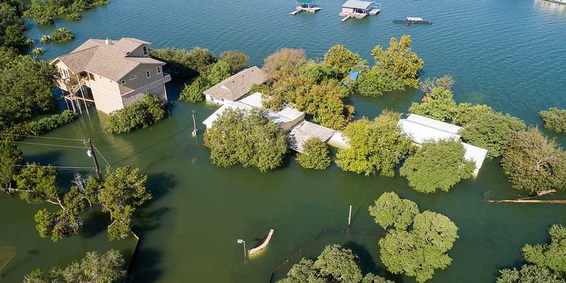 Mansions and luxury homes flooded next to a body of water