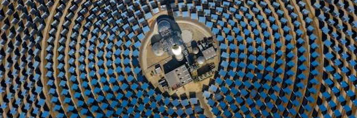 Many solar panels arranged in a circular pattern viewed from above
