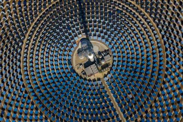 Many solar panels arranged in a circular pattern viewed from above