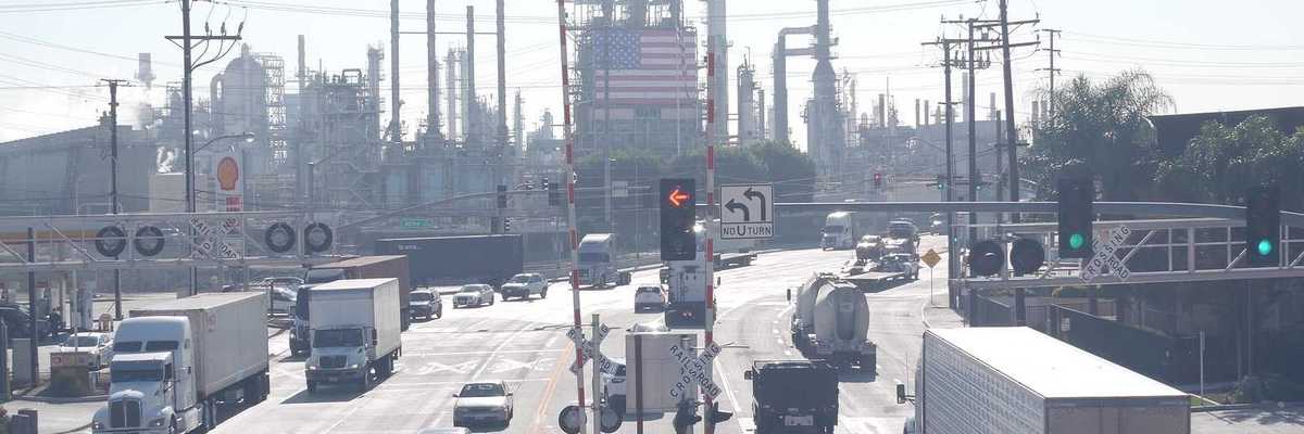 Marathon oil refinery, Los Angeles. Petroleum, chemicals and gasoline factory. American flag and smokestacks of industrial petrochemicals plant.