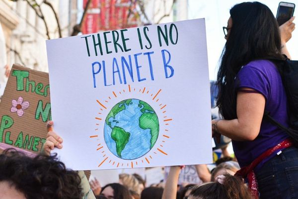 Marching for climate with sign: "There Is No Planet B"