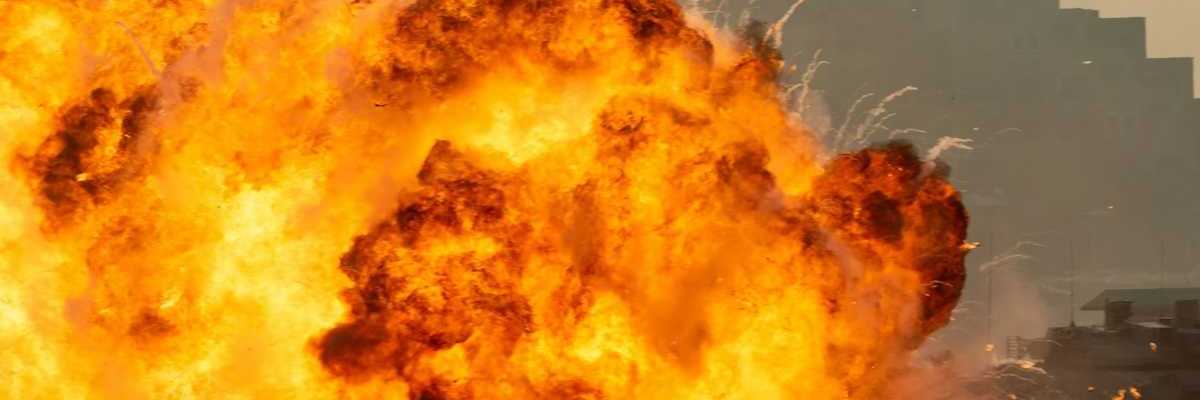 Massive fire explosion close up in military combat and war. Vehicle explosion from a tank in a city in the Middle East.