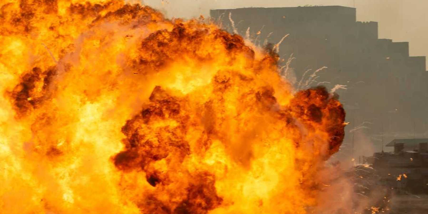 Massive fire explosion close up in military combat and war. Vehicle explosion from a tank in a city in the Middle East.