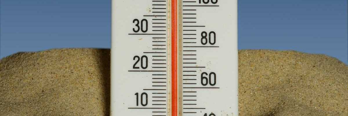 Mercury thermometer stuck in the sand and reading 40 degrees C/104 degrees F