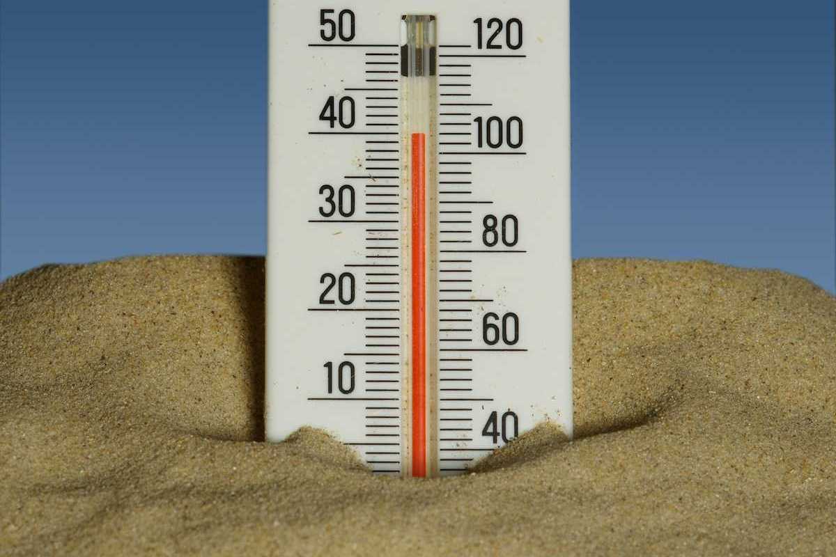Mercury thermometer stuck in the sand and reading 40 degrees C/104 degrees F