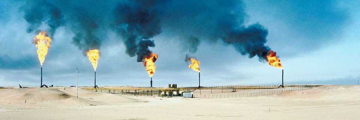 Methane gas being burned off from five gas stacks