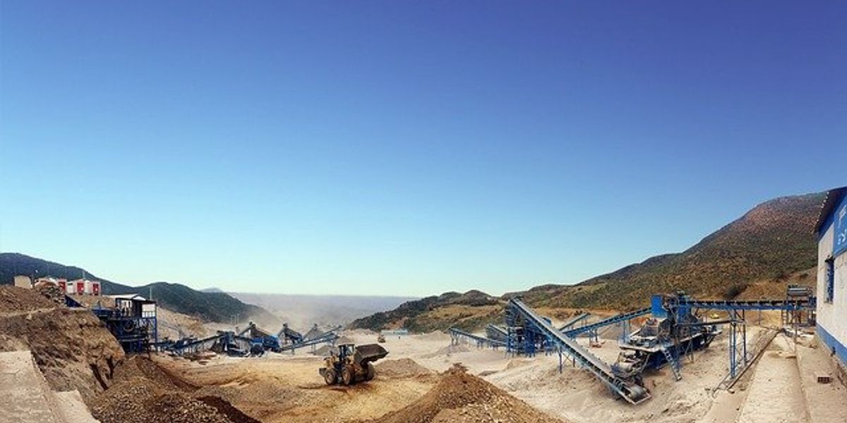 Mine site with dirt and equipment.