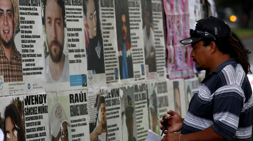 Missing person posters line a street in Guadalajara, in the Mexican state of Jalisco, in 2022.