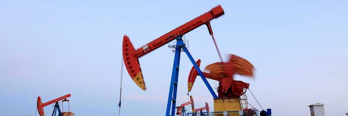 New fracking wells with multicolored array of pumpjacks in close proximity