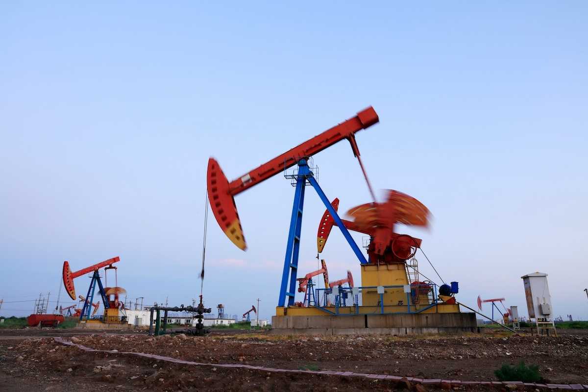 New fracking wells with multicolored array of pumpjacks in close proximity
