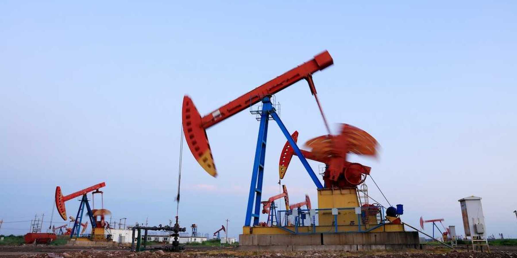 New fracking wells with multicolored array of pumpjacks in close proximity