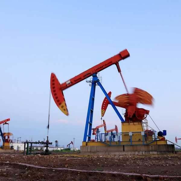 New fracking wells with multicolored array of pumpjacks in close proximity