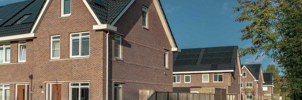Newly built brick houses with solar panels