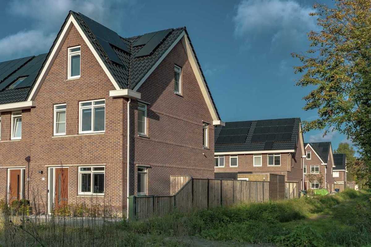 Newly built brick houses with solar panels