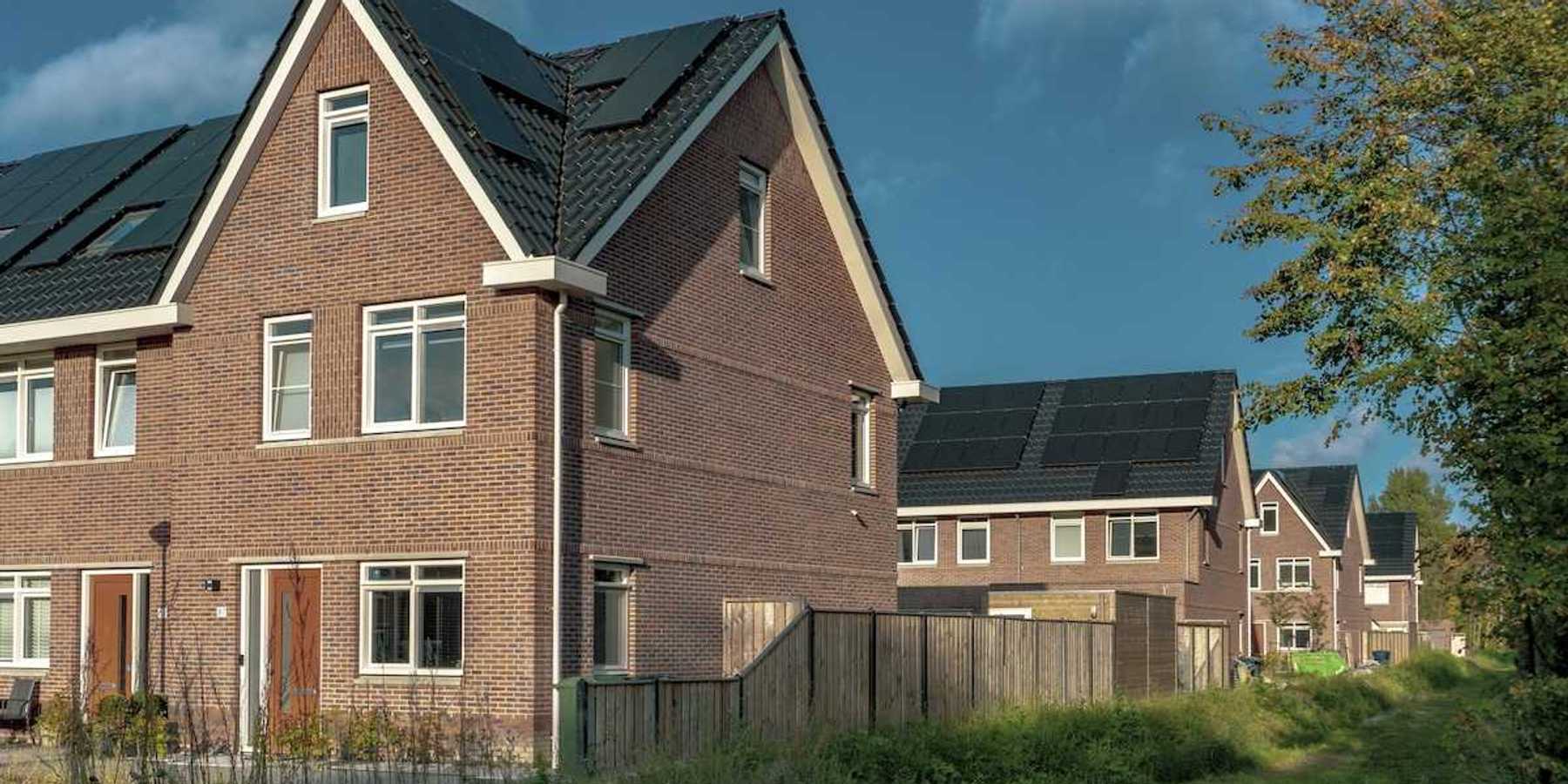 Newly built brick houses with solar panels