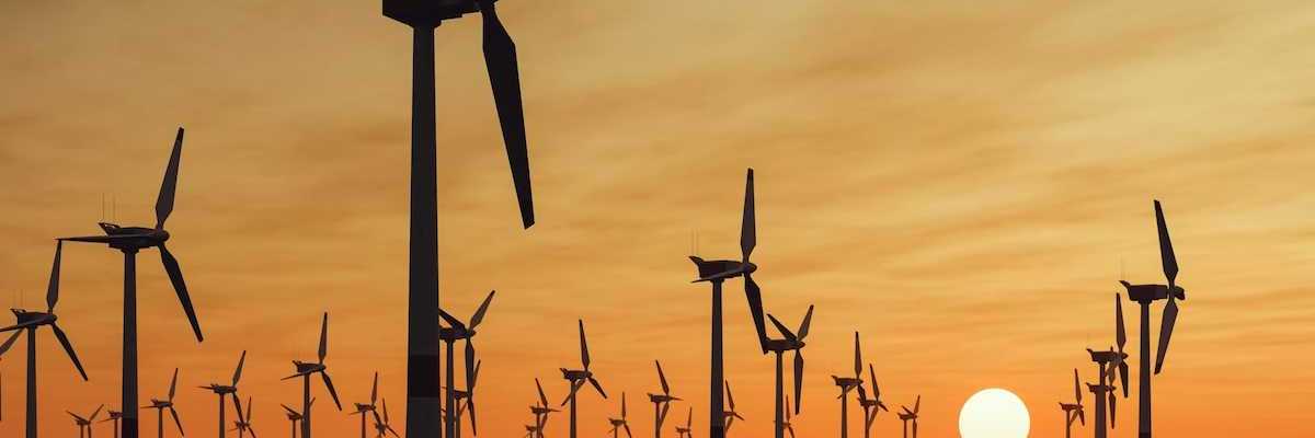 Offshore wind farm against a setting sun