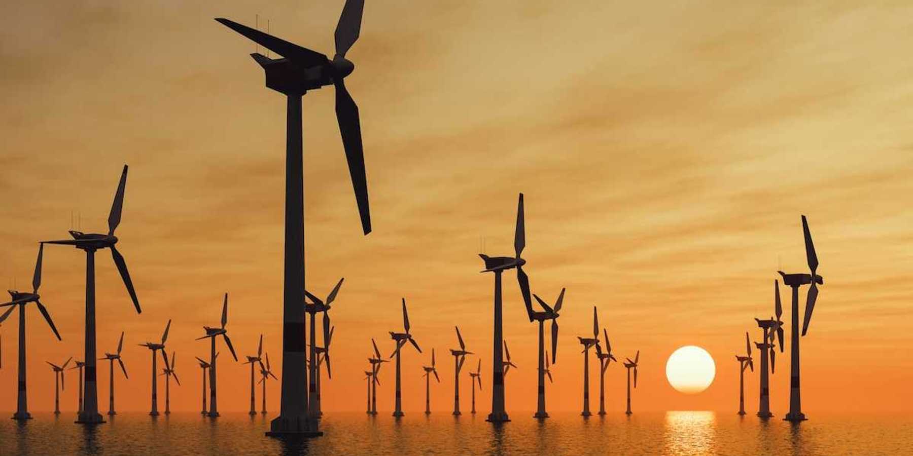 Offshore wind farm against a setting sun