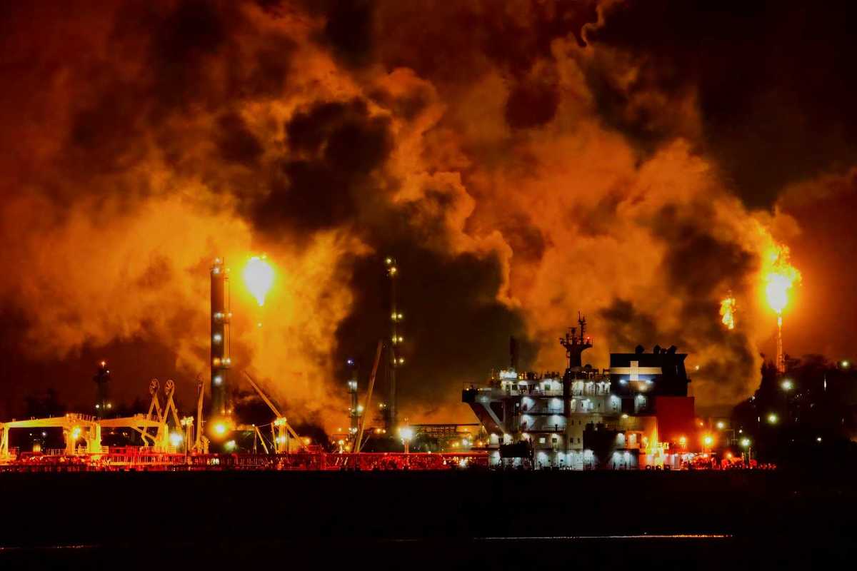 Oil and gas facility flaring excess methane at night