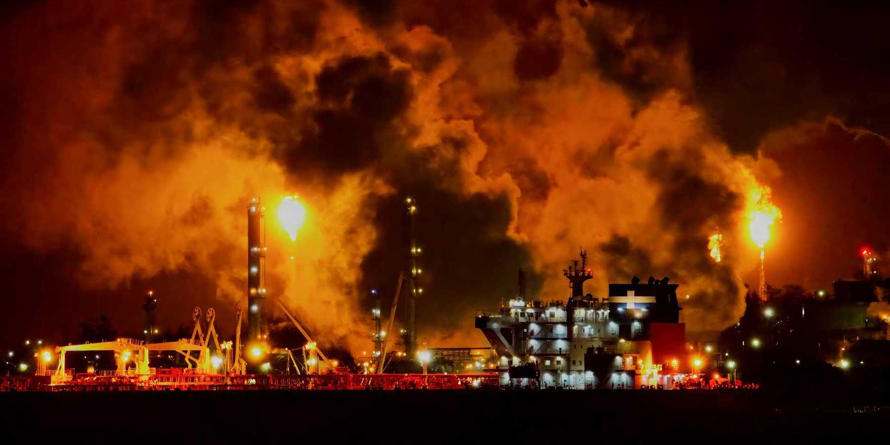 Oil and gas facility flaring excess methane at night