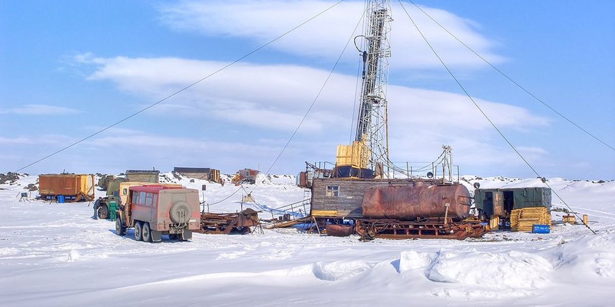 oil drilling tower in snowy landscape